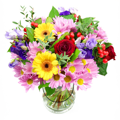 A large, mixed bouquet in a clear glass vase is shown against a pure white backdrop, allowing its colours to glow as if in soft Clerkenwell daylight. At the centre, sumptuous red roses open in tight spirals, their velvety petals suggesting both passion and comfort, like a familiar walk down St John Street at dusk. Flanking them, two bold yellow gerbera daisies with dark brown-orange centres bring a lively, almost sunlit energy that instantly lifts the mood. Surrounding these focal blooms, generous clusters of pink daisies or chrysanthemums create a cushion of softness; their many slender petals and tiny yellow centres give the design a gentle, cloud-like volume. Threaded between the pinks and yellows, slender stems of purple and lavender lisianthus unfurl graceful, bell-shaped flowers, lending the arrangement depth and a cool, elegant undertone. Scattered throughout, small round hypericum berries in bright, lacquered red peek out like tiny jewels, adding an unexpected texture that feels modern and playful, perfect for a Clerkenwell studio or town house. A mix of greenery-from deep, glossy leaves to lighter, airy sprigs-frames and supports the blooms, echoing the relaxed greenery of nearby local squares. The clear vase reveals the carefully cut stems, neatly arranged in clear water that anchors the bouquet and shows the florist's practiced hand. The overall impression is of a joyful yet polished gift, ideal for same-day delivery to an EC1 office celebration, a cosy restaurant near Farringdon, or as a warm "thinking of you" gesture that fills the room with colour and quiet celebration.