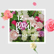 At the heart of this image is a rich, hand-gathered bouquet of roses that feels like a visual promise of flowers arriving month after month in Clerkenwell. The roses are tightly grouped, forming a lavish dome of colour where soft blush, cream, pale lilac, and vivid fuchsia mingle with deeper raspberry accents. Each bloom shows a unique character: some cupped and modest, others lavishly open with ruffled centres and gently curling edges. The petals appear thick and velvety, the kind that feel cool and silky when lightly brushed with your fingertips. Around them, glossy green foliage peeks through, adding structure and a fresh, garden-like energy, similar to discovering a hidden courtyard near St John's Square. The bouquet rests against an understated cream background, which lets every tone stand out and gives the composition a refined, gallery-like feel. Scattered rose petals and smaller blossoms float around the central cluster, as though they have been caught in an invisible breeze blowing along Clerkenwell Road, lending a sense of movement and playful anticipation. Gentle, diffused light glides across the arrangement, highlighting creamy petal edges and deepening the shadows at the roses' centres, suggesting impeccable freshness and expert conditioning. You can almost imagine this bouquet arriving as part of a 12-month flower subscription, transforming a Clerkenwell office, a design studio near Farringdon, or a compact city flat into a softer, more welcoming space, month after month. The image carries a mood of quiet joy and enduring affection, making it perfect for all-occasion gifting, from birthdays and thank-you gestures to simple reminders that someone is thinking of you throughout the year.