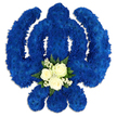 A bold and reverent Sikh Khanda floral tribute is set against a crisp white background, its strong silhouette immediately capturing the eye. The entire religious emblem - the upright central sword, the encircling chakkar, and the two flanking kirpans - has been carefully constructed from countless small royal blue chrysanthemum blooms, each one nestled closely to create a solid, plush texture. The blue colour is rich and unwavering, a deep shade that suggests dignity, devotion, and quiet strength, much like the composed atmosphere of a Clerkenwell memorial service. Gentle, diffused lighting casts soft shadows around the edges of the symbol, making the arrangement appear slightly elevated from the surface and giving the impression of a hand-crafted sculpture made from living flowers. At the meeting point of the central blade and the lower curve of the design, a small cluster of contrasting blooms draws the gaze. Three immaculate white roses sit at the centre, their petals smooth and delicately layered, surrounded by wisps of tiny white filler flowers and touches of lustrous green foliage. This central posy introduces an element of tenderness and purity, standing out against the strong blue background as a symbol of peace, love, and farewell. The overall composition feels balanced and intentional, ideal for a Sikh funeral, remembrance ceremony, or tribute in the Clerkenwell area. Every curve, colour choice, and textural contrast reflects the work of a knowledgeable florist translating faith, respect, and community care into a single, powerful floral statement.