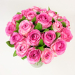 A lush, hand-gathered bouquet of roughly two dozen pink roses sits in a simple clear glass vase, photographed against a softly lit white background from a slightly elevated angle so the rounded, generous dome of blooms fills the frame. Each rose is at least fully or nearly fully open, the velvety petals unfurling in concentric layers that shift in tone from a deep fuchsia at the heart through mid-pink to a pale, blushing edge, creating a natural gradient that gives the arrangement depth and movement. Dark green, glossy leaves are tucked throughout, their cool, slightly textured surfaces providing a crisp counterpoint to the tender petals and enhancing the bouquet's fresh, organic feel. The overall impression is one of abundant, carefully cultivated vitality: you can almost feel the soft resistance of the petals between your fingers and catch a faint, powdery rose scent that feels intimate and reassuring. The diffuse studio light brightens every petal without harsh shadows, lending a clean, timeless quality that suits romantic gifts, anniversaries, Mother's Day, or celebratory centrepieces. Seen through the sensibility of a local florist, this arrangement reads as classic but modern - elegant enough for a wedding table, warm enough for a bedside surprise, and bright enough to lift a living room. For people in Clerkenwell, from Exmouth Market to Clerkenwell Green, this bouquet embodies the neighbourhood's quiet charm: unpretentious, refined, and full of colour and good cheer, a floral gesture that quietly says love, gratitude, and celebration.