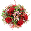 A sumptuous, rounded bouquet is laid out against a pristine white background, photographed from above so every flower can be appreciated as if you were looking down at it on a florist's table near Clerkenwell Green. At its core are several stunning deep red roses, fully open and velvety, their layered petals swirling inward to form rich, almost sculptural centres that immediately convey passion and romance. Nestled around and between these roses are airy sprays of pale pink waxflowers; their diminutive, star-shaped blooms and soft yellow stamens provide a delicate, almost confetti-like contrast that lightens the intensity of the crimson. The florist has built a generous dome of flowers and foliage, the bouquet tightly packed yet thoughtfully arranged so that each element feels intentional, much like a bespoke design created for a boutique hotel or office off Farringdon Road. Fresh green leaves of varying shapes and textures provide a vibrant, living framework, from stout, glossy foliage to more slender, textural sprigs that add lift and volume. Threaded among the greenery and blooms are bronzed and burgundy-toned leaves, some marked with visible reddish-brown veins, lending an elegant, slightly autumnal note that enriches the palette of reds and pinks. Tucked in close to the roses are smaller, darker red flowers-possibly alstroemeria or similar varieties-whose elongated petals add another layer of interest and depth. At the base, partly hidden, a flash of red and white patterned tag or ribbon suggests this is a carefully wrapped gift, perhaps ready for same-day delivery to a romantic dinner, a birthday celebration, or a quiet thank-you moment in one of Clerkenwell's stylish apartments.