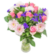 This poetic bouquet, crafted in the heart of Clerkenwell, weaves together softly blushed roses and delicate gerbera daisies, their pastel pinks warmed by gentle London daylight and complemented by lush green foliage. Each rose unfurls velvet petals, radiating with youthful affection, while playful pockets of vibrant violet statice peek through, their papery textures and subtle fragrance infusing the arrangement with cheerful spontaneity. The bouquet feels light and full, reminiscent of wildflowers gathered just off Clerkenwell Road-spirited yet tranquil. Nestled within a clear vase that showcases every verdant stem, the design reflects thoughtful craftsmanship and a deep-rooted passion for the art of floristry. Whether chosen to celebrate a birthday near Smithfield, to congratulate a friend on a new Clerkenwell studio, or to simply share quiet admiration, every bloom is selected for beauty and meaning. The recipient is sure to feel cherished, surrounded by the gentle, optimistic spirit that defines this neighborhood's creative soul.
